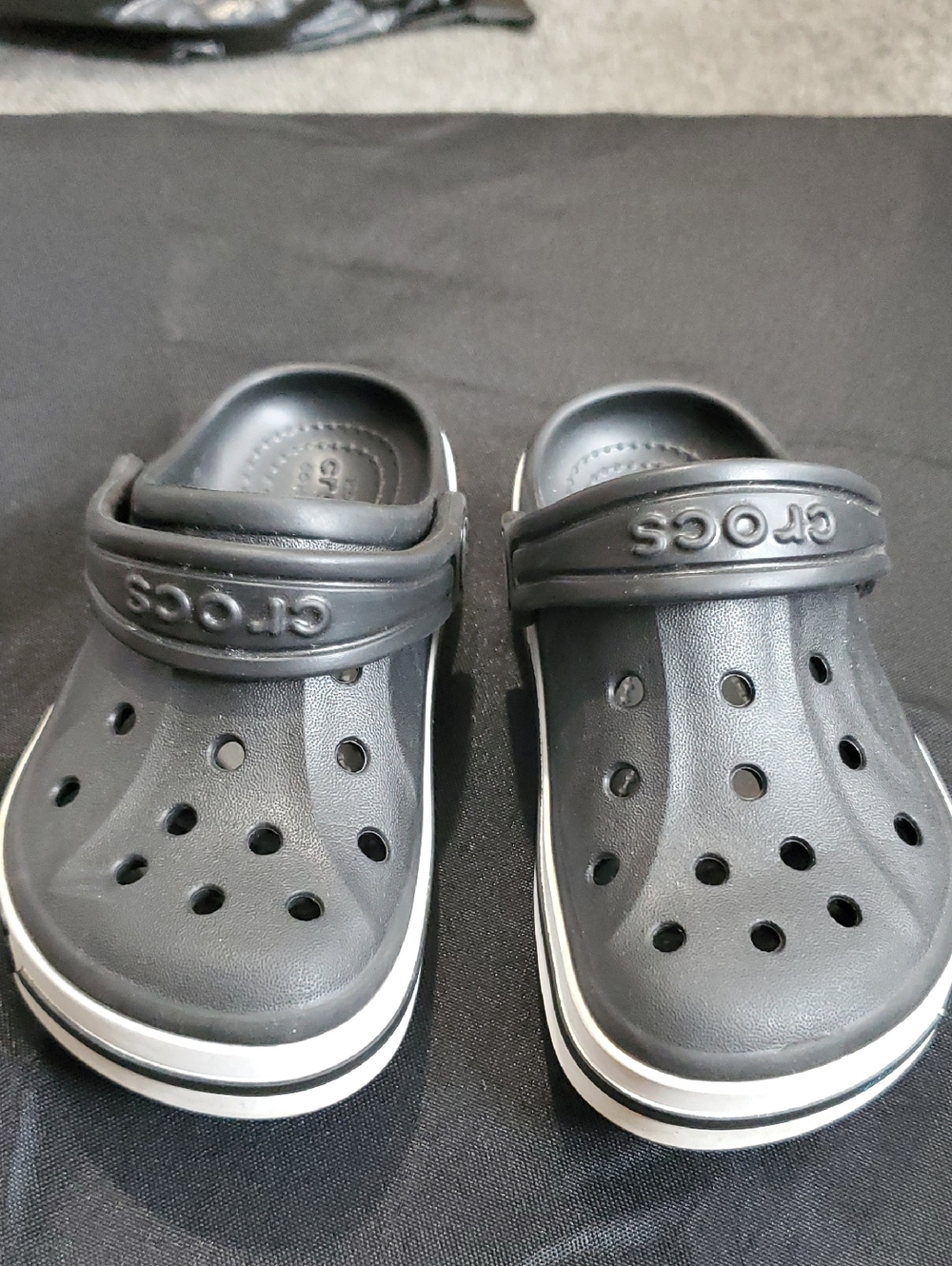 CROCS Kids Black Clogs with White Stripe